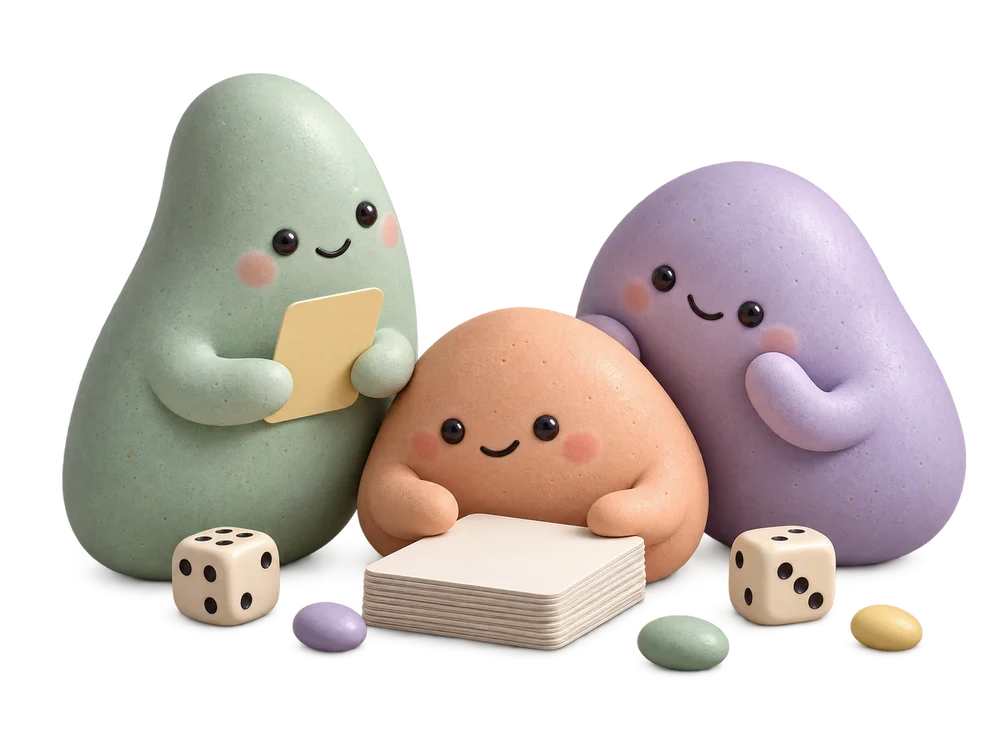 Three mint, peach, and lavender pebble friends gathered around a deck of cards